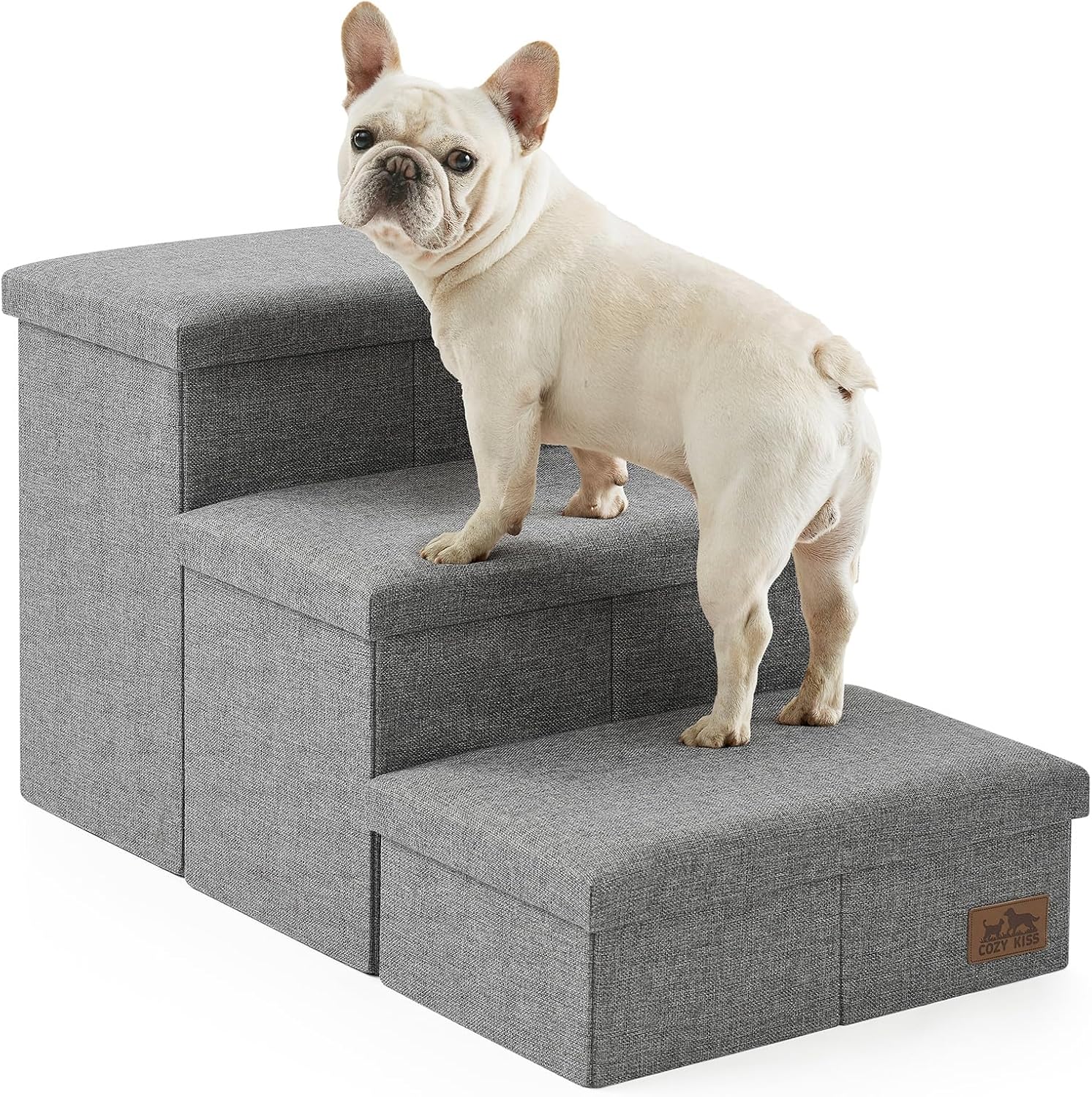 COZY KISS dog stairs in use by a small dog climbing onto a sofa